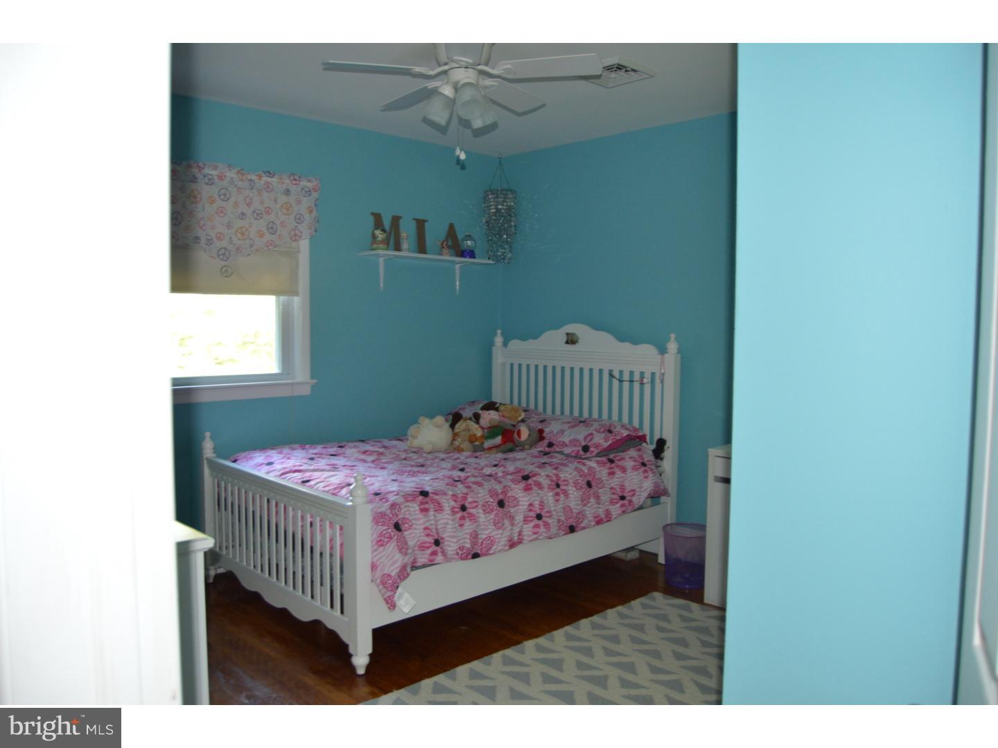 16 Dublin Road Pennington, NJ 08534 - Photo 7 of 19 a bedroom with a bed and a window