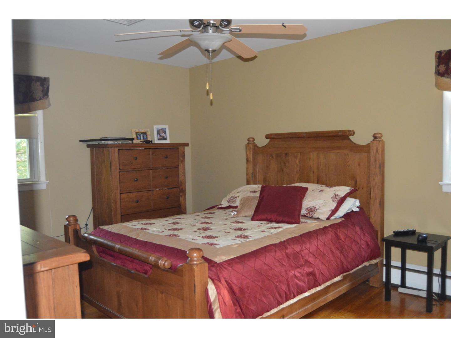 16 Dublin Road Pennington, NJ 08534 - Photo 10 of 19 a bed sitting in a bedroom and dresser