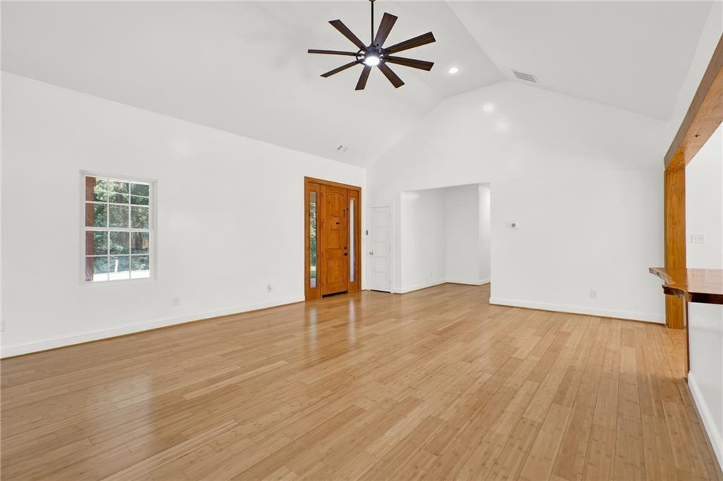 2794 Cleburne Parkway Powder Springs, GA 30127 - Photo 11 of 49 wooden floor in an empty room with a window