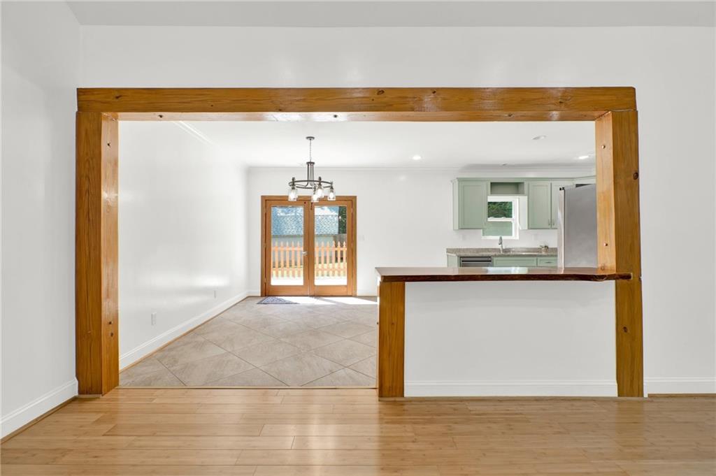 2794 Cleburne Parkway Powder Springs, GA 30127 - Photo 12 of 49 a view of kitchen and hall with wooden floor