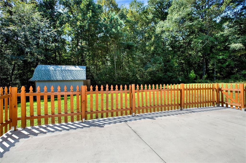 2794 Cleburne Parkway Powder Springs, GA 30127 - Photo 15 of 49 a view of a wooden fence