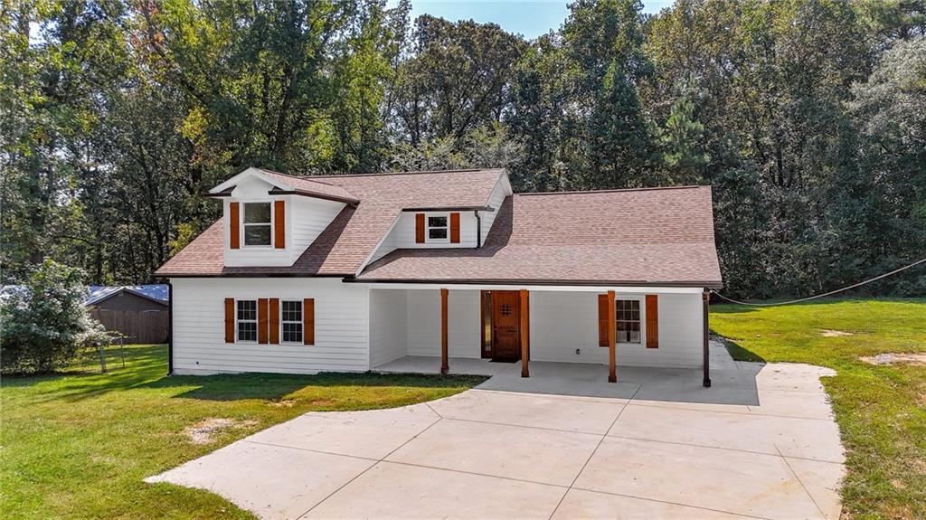 2794 Cleburne Parkway Powder Springs, GA 30127 - Photo 2 of 49 a front view of a house with a yard