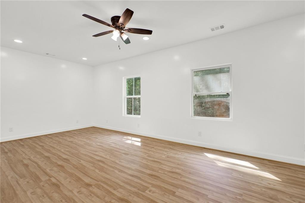 2794 Cleburne Parkway Powder Springs, GA 30127 - Photo 22 of 49 wooden floor in an empty room with a window