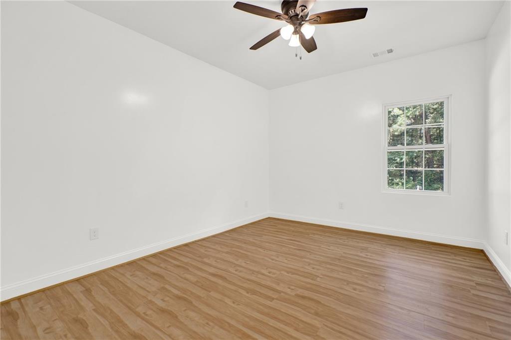 2794 Cleburne Parkway Powder Springs, GA 30127 - Photo 28 of 49 wooden floor in an empty room