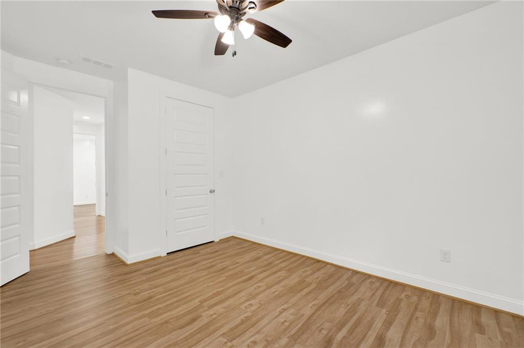2794 Cleburne Parkway Powder Springs, GA 30127 - Photo 29 of 49 wooden floor in an empty room