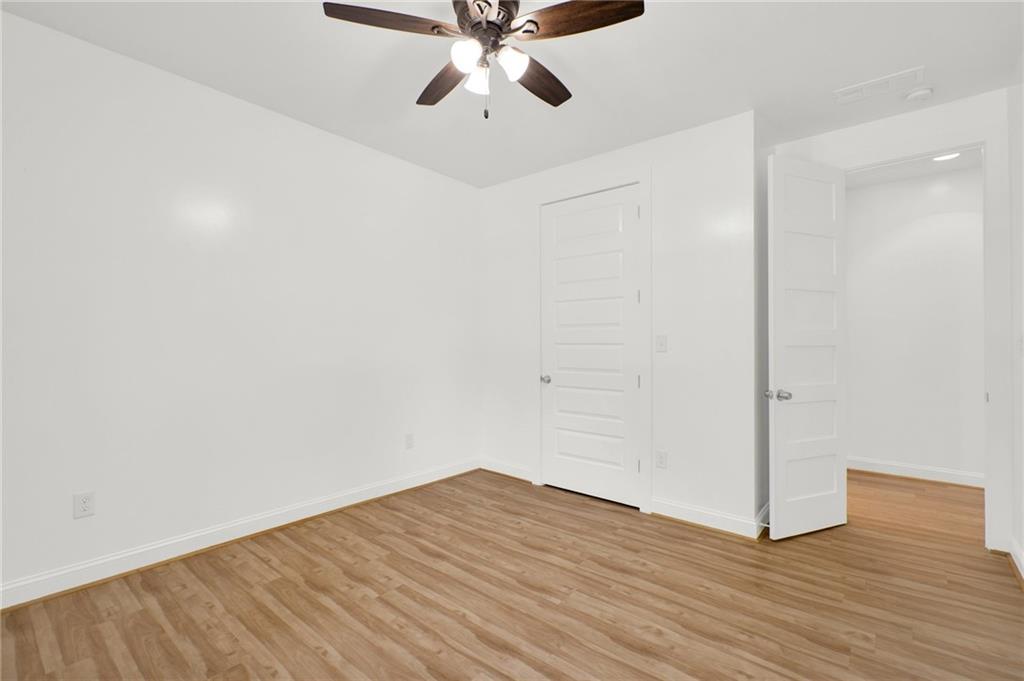 2794 Cleburne Parkway Powder Springs, GA 30127 - Photo 31 of 49 a view of empty room with wooden floor