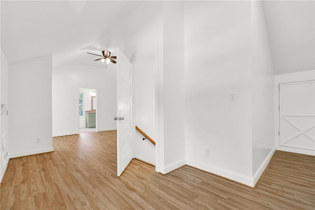 2794 Cleburne Parkway Powder Springs, GA 30127 - Photo 34 of 49 a view of a room with wooden floor and staircase