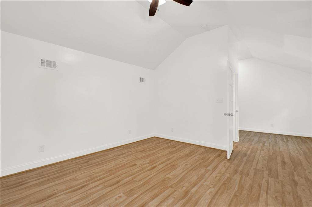 2794 Cleburne Parkway Powder Springs, GA 30127 - Photo 37 of 49 a view of an empty room with wooden floor