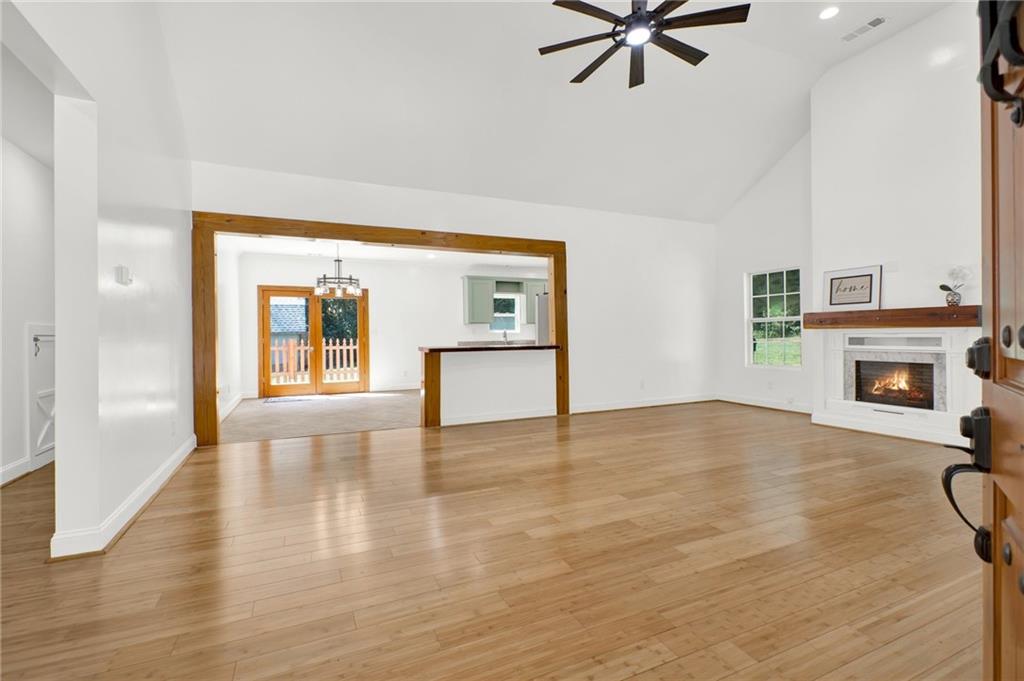 2794 Cleburne Parkway Powder Springs, GA 30127 - Photo 7 of 49 a view of empty room with wooden floor and fireplace