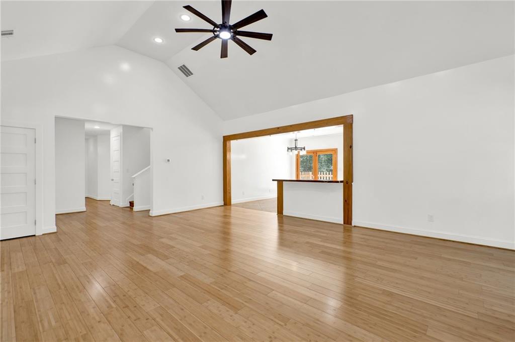 2794 Cleburne Parkway Powder Springs, GA 30127 - Photo 9 of 49 a view of an empty room with a window and wooden floor