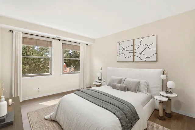 a bedroom with a bed and a window