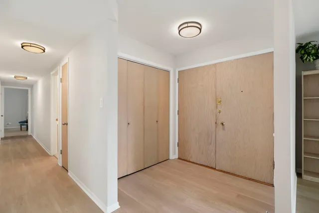 a view of a hallway with closet area
