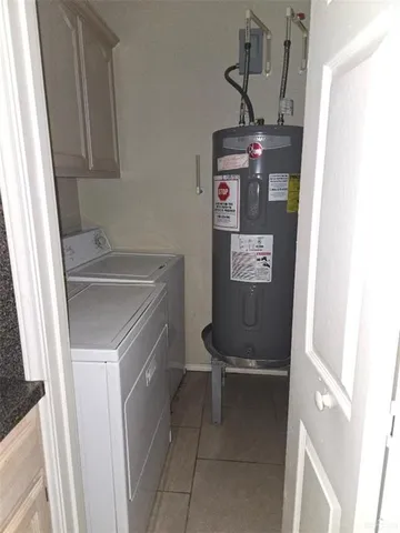a room with a sink and a refrigerator