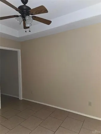 a view of a chandelier fan and closet in a room