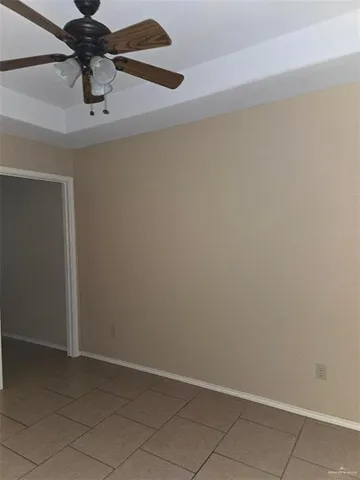 a view of a chandelier fan and closet in a room
