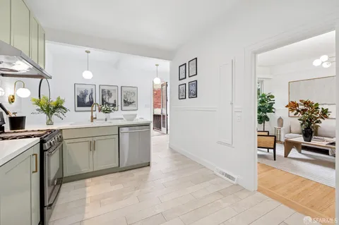 a spacious bathroom with a sink and a mirror