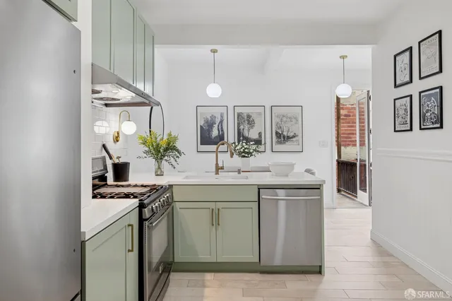 a kitchen with a sink and stove