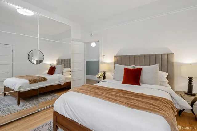 a bedroom with bed and a window