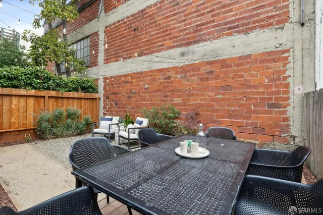 swimming pool view with a seating space