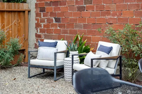 a outdoor living space with furniture and a potted plant