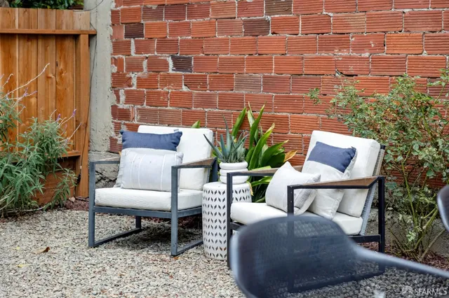 a outdoor living space with furniture and a potted plant