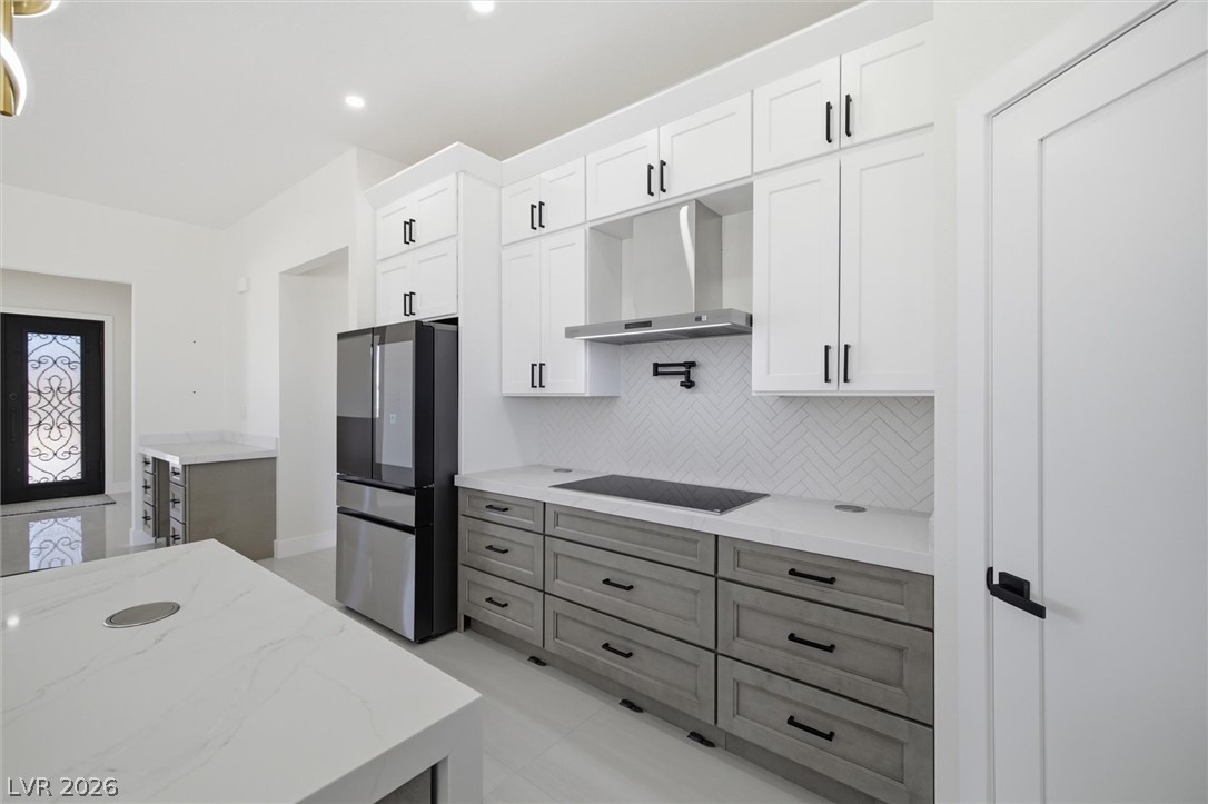 5910 East Kellogg Road Pahrump, NV 89061 - Photo 20 of 58 Modern kitchen with sleek cabinetry and integrated appliances awaits culinary adventures.