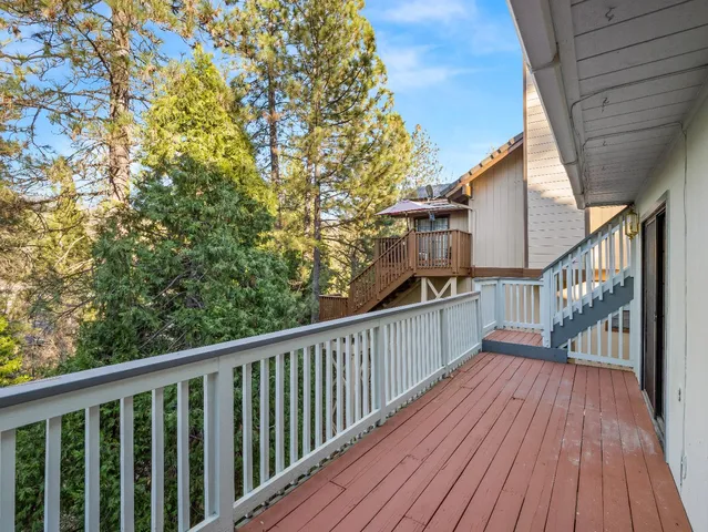 a view of balcony with wooden floor