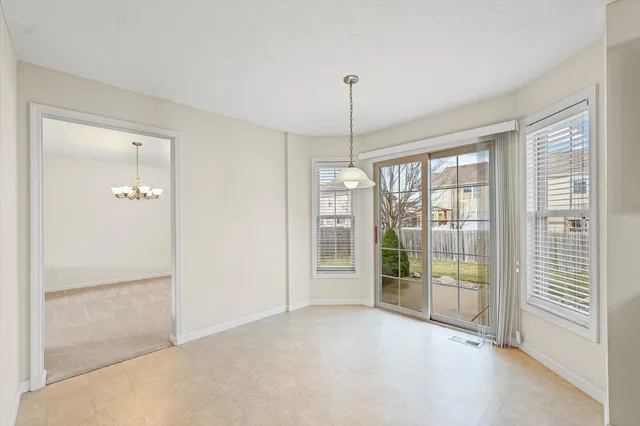 a view of an empty room with windows