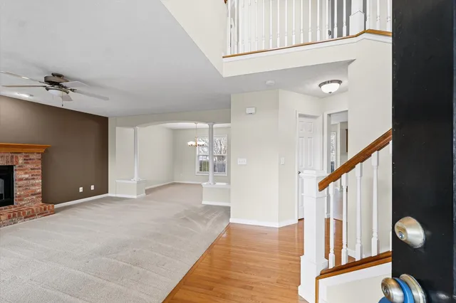 a view of an entryway with wooden floor
