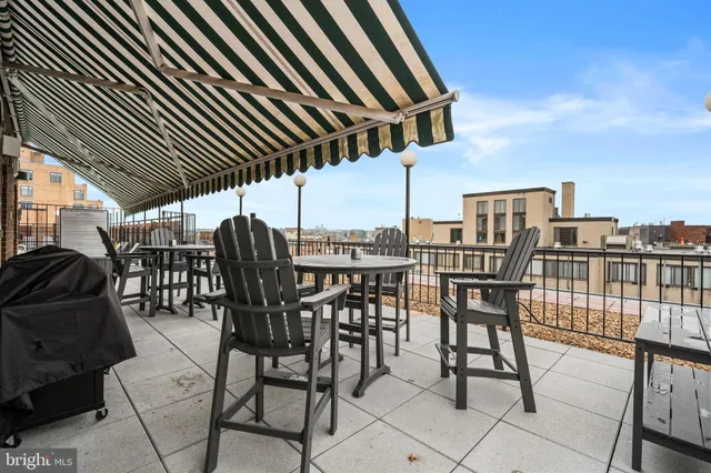 a view of a chairs and table in the patio