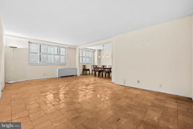 a view of empty room with furniture and fireplace