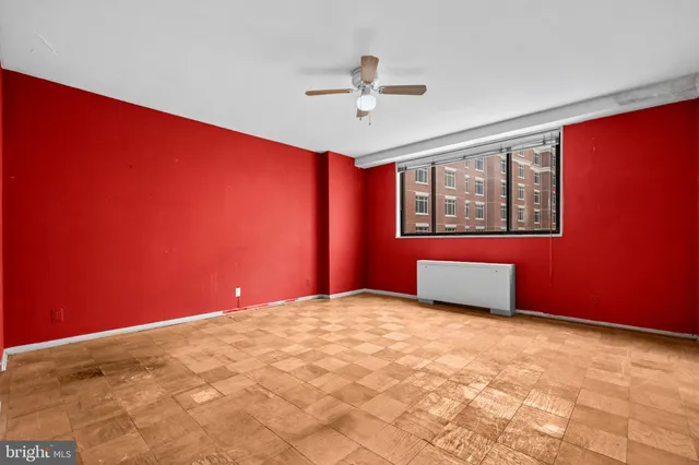 a view of an empty room with a window