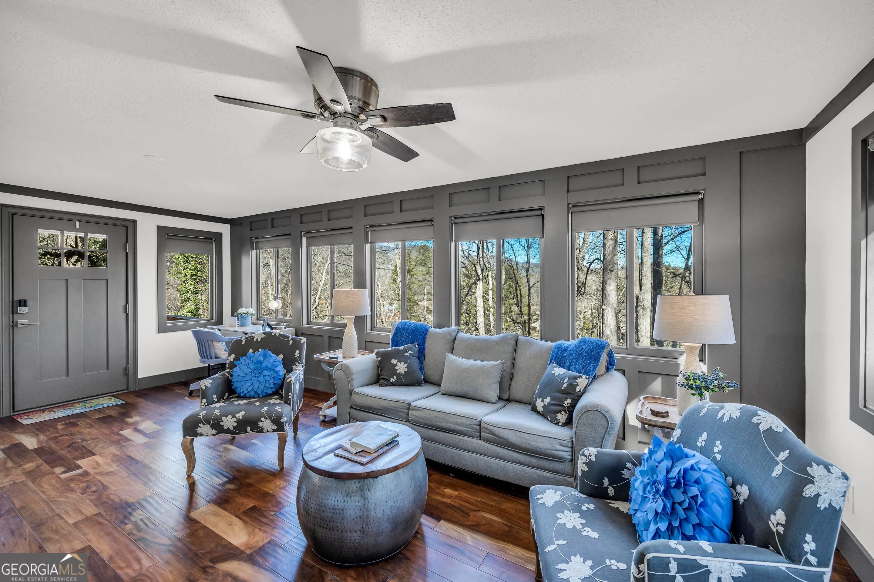 153 Coleman Heights Lane Rabun Gap, GA 30568 - Photo 27 of 57 a living room with furniture and a large window