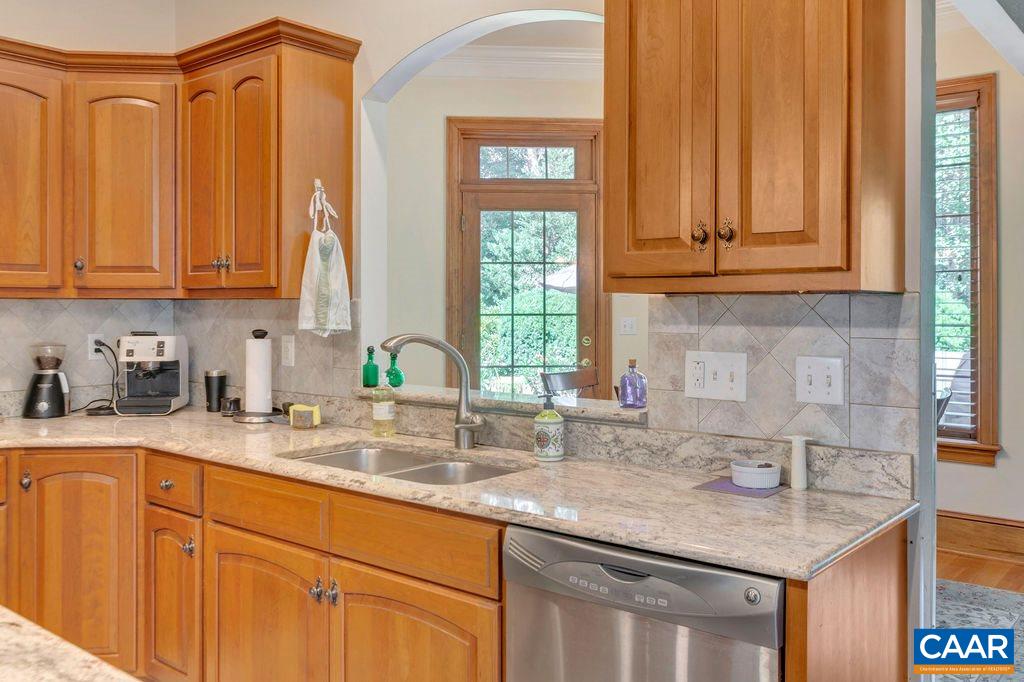 3164 Darby Road Keswick, VA 22947 - Photo 23 of 47 a kitchen with stainless steel appliances granite countertop a sink a refrigerator and cabinets