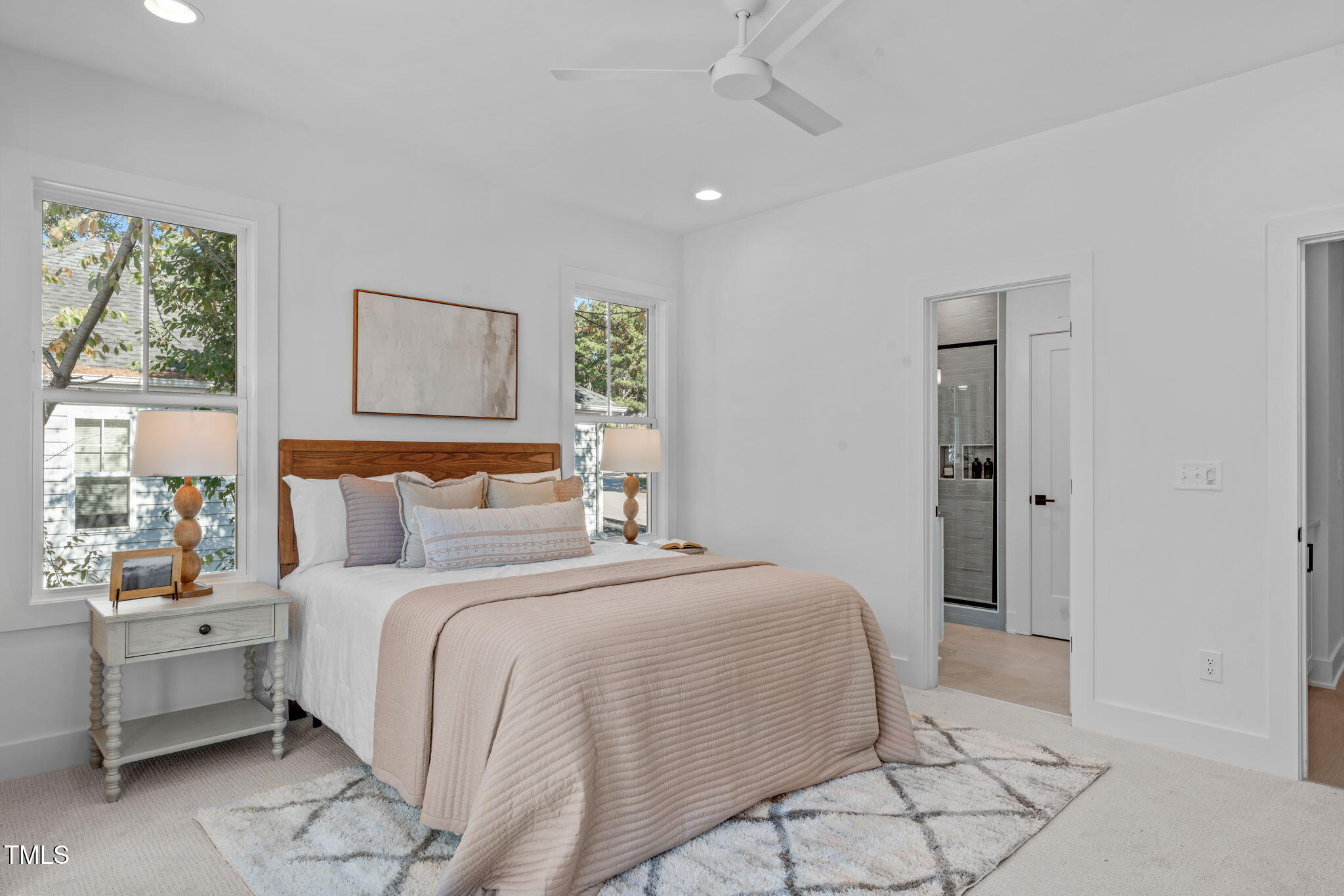 5053 Lundy Drive, Unit 101 Raleigh, NC 27606 - Photo 16 of 47 a bedroom with a bed and a painting on the wall
