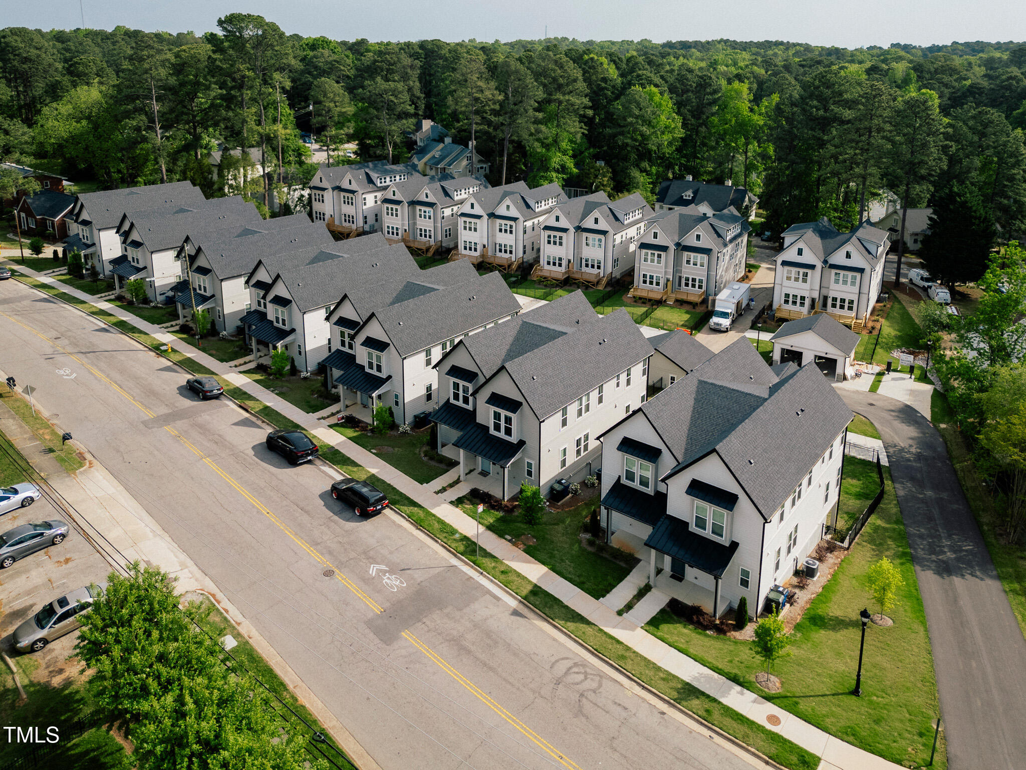 5053 Lundy Drive, Unit 101 Raleigh, NC 27606 - Photo 38 of 47 an aerial view of a house with garden