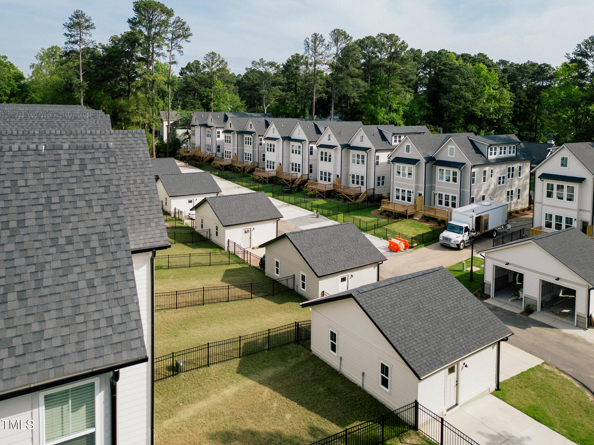 5053 Lundy Drive, Unit 101 Raleigh, NC 27606 - Photo 40 of 47 a aerial view of a house with a yard
