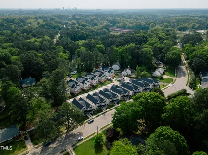 an aerial view of a town with trees