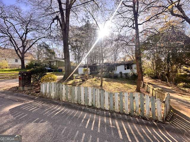 a view of outdoor space and yard with wooden fence