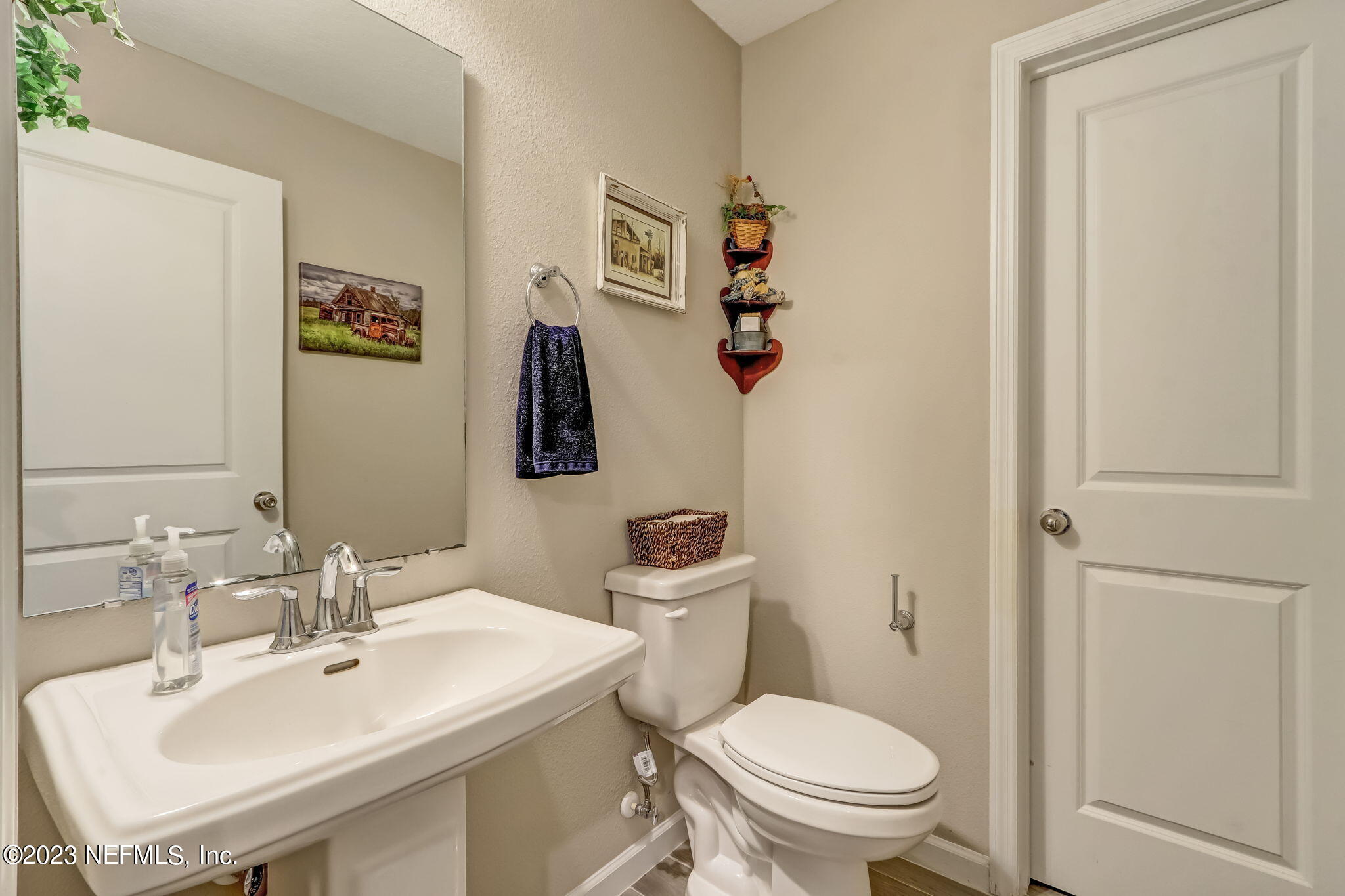 75764 Spoonbill Lane Yulee, FL 32097 - Photo 11 of 34 a bathroom with a sink mirror and toilet