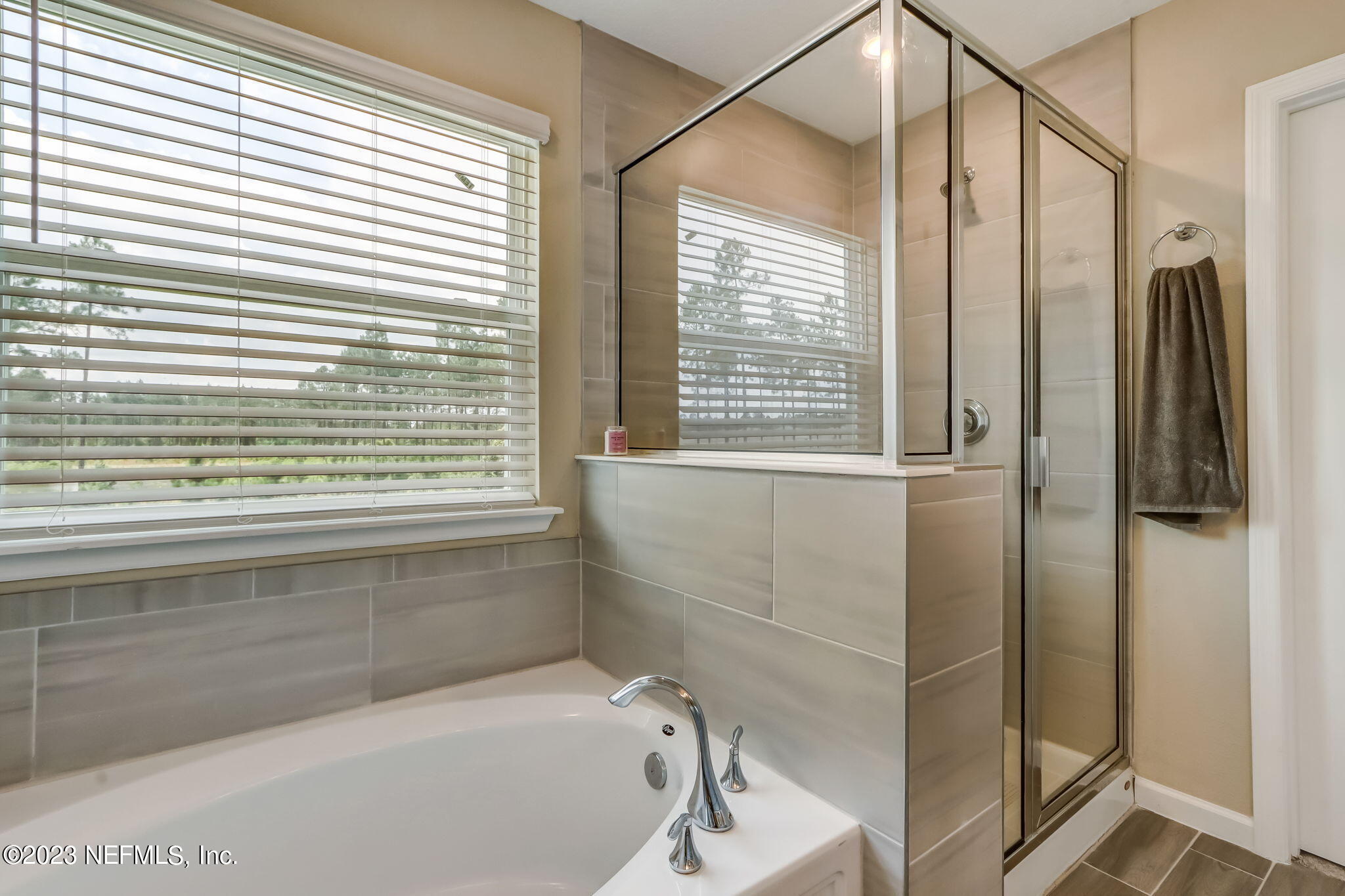 75764 Spoonbill Lane Yulee, FL 32097 - Photo 14 of 34 a bathroom with a bathtub and a shower
