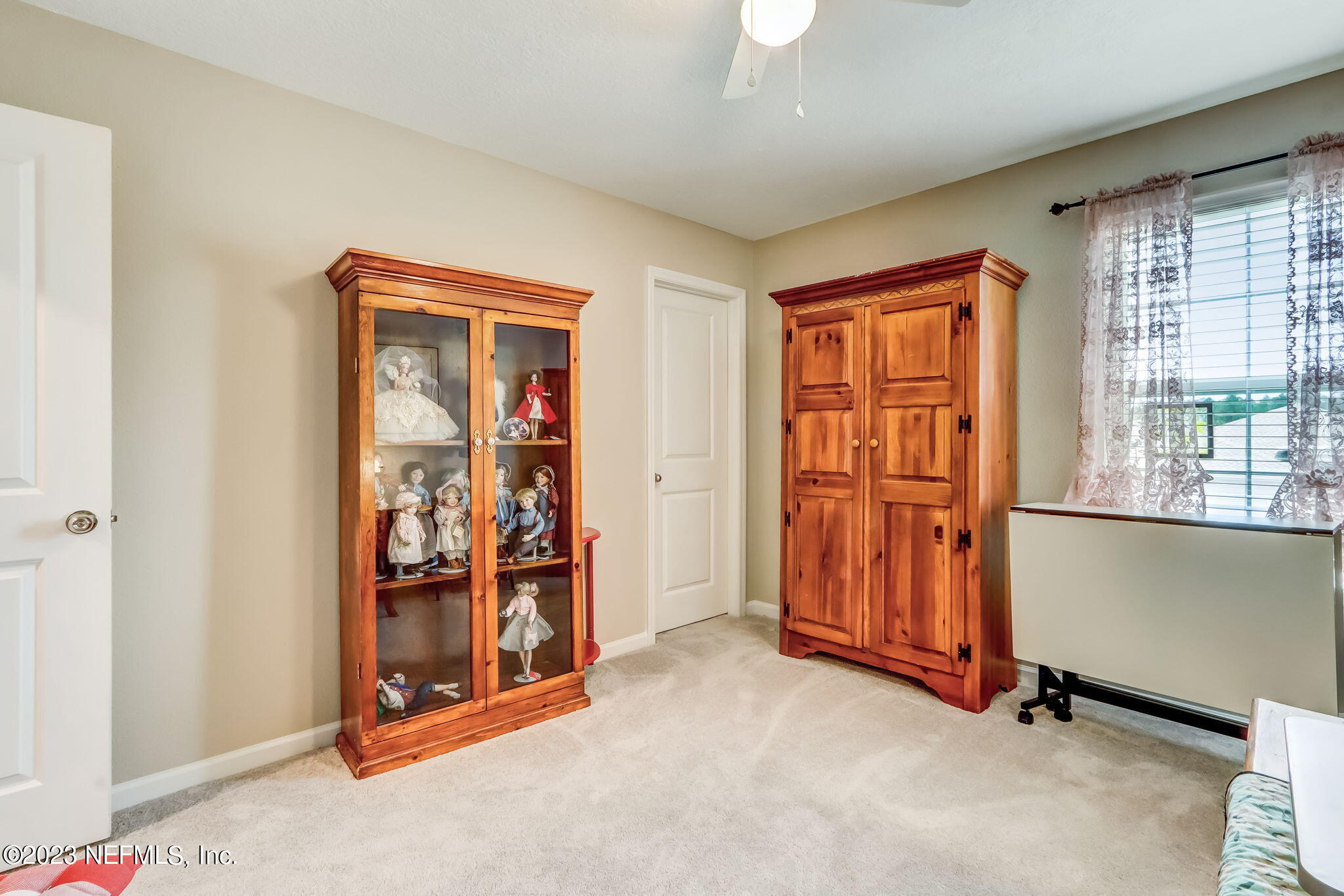 75764 Spoonbill Lane Yulee, FL 32097 - Photo 16 of 34 an empty room with wooden floor and windows