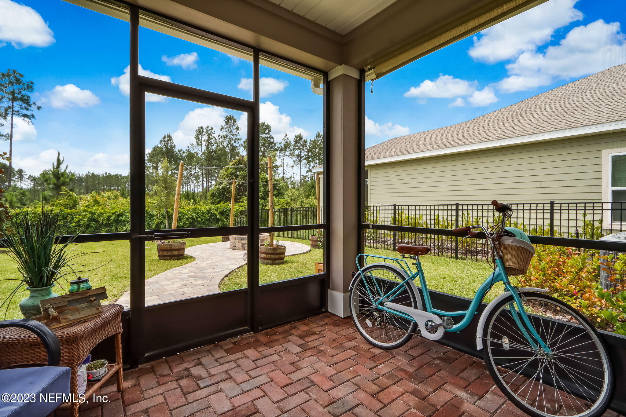 75764 Spoonbill Lane Yulee, FL 32097 - Photo 19 of 34 a utility room with large windows and table