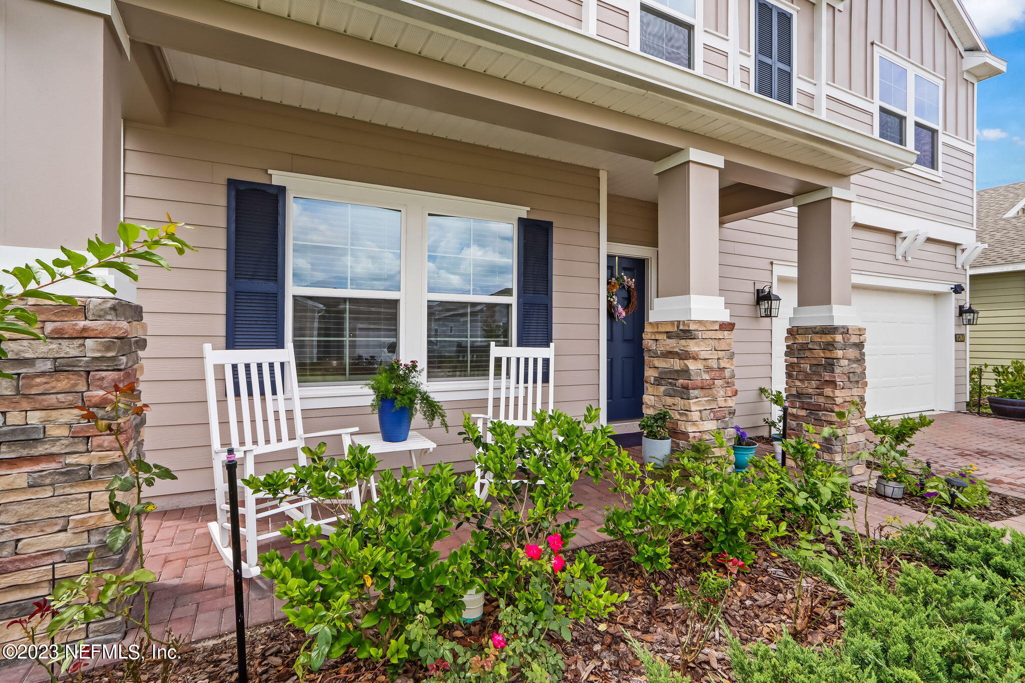 75764 Spoonbill Lane Yulee, FL 32097 - Photo 2 of 34 front view of a brick house with a large windows
