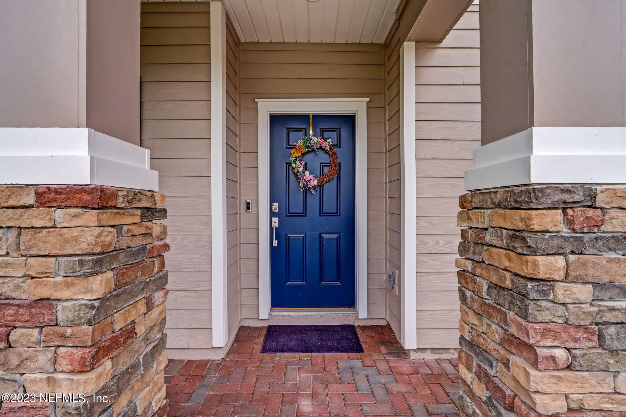 75764 Spoonbill Lane Yulee, FL 32097 - Photo 3 of 34 a view of front door of house with stairs