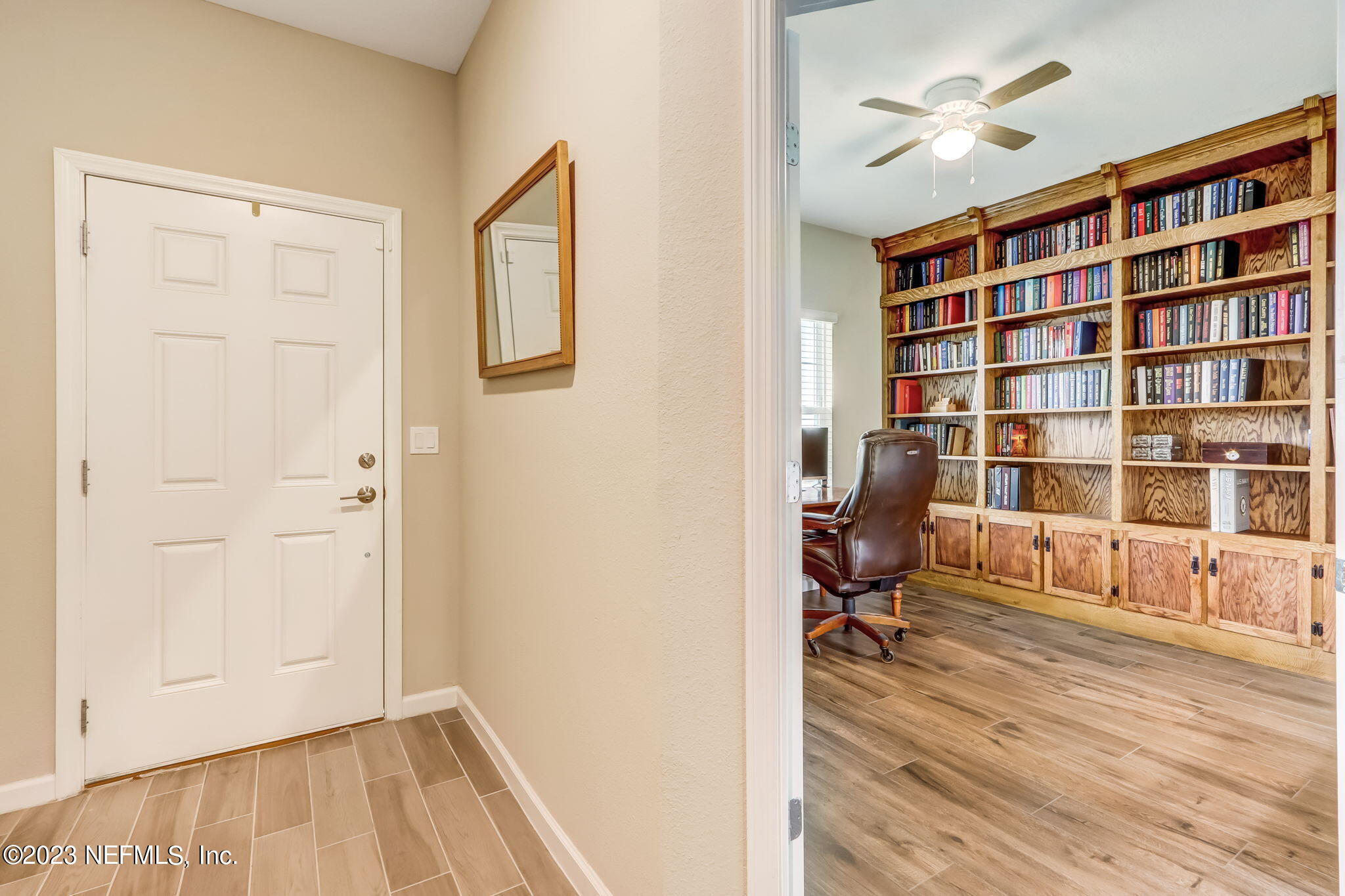 75764 Spoonbill Lane Yulee, FL 32097 - Photo 5 of 34 a view of a workspace with furniture and wooden floor