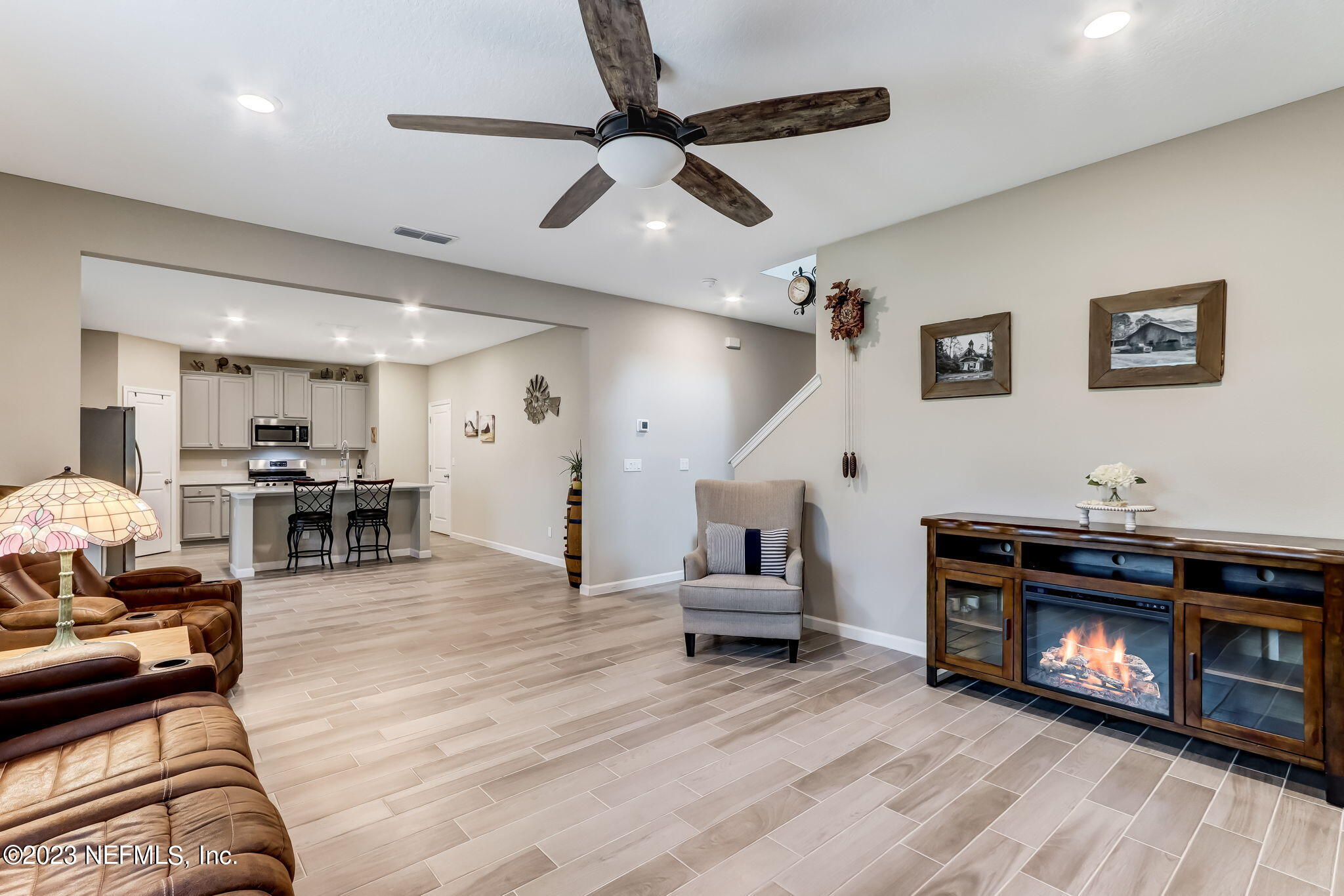 75764 Spoonbill Lane Yulee, FL 32097 - Photo 6 of 34 a living room with furniture and a fireplace