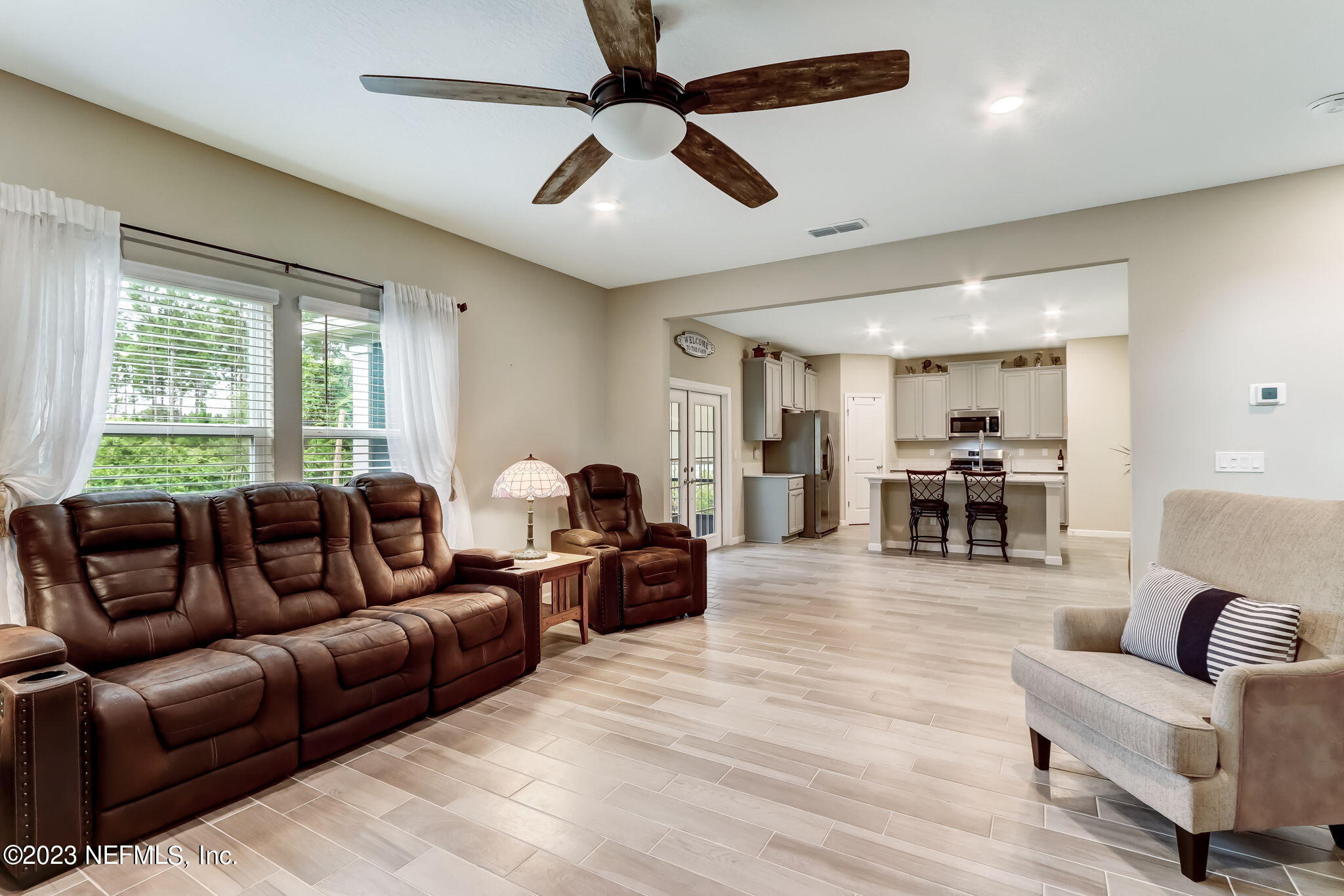75764 Spoonbill Lane Yulee, FL 32097 - Photo 7 of 34 a living room with furniture and a large window