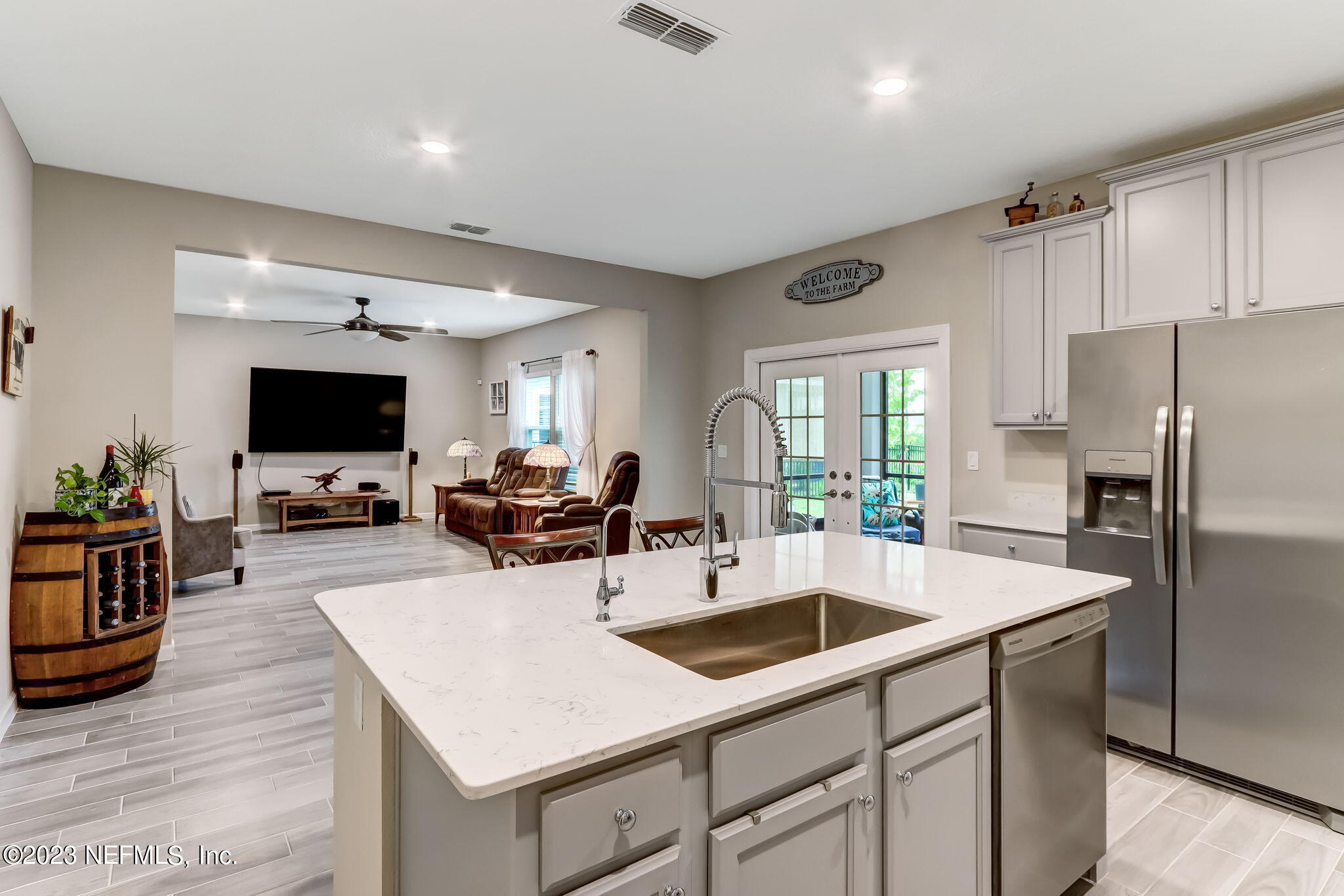 75764 Spoonbill Lane Yulee, FL 32097 - Photo 10 of 34 a kitchen with a sink a counter top space and stainless steel appliances