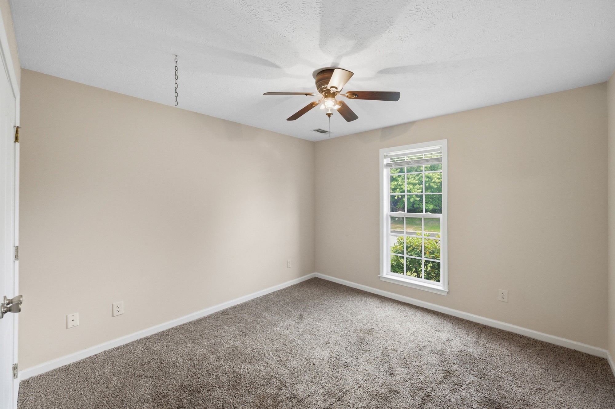 270 Reed Circle Medina, TN 38355 - Photo 24 of 30 an empty room with windows and fan